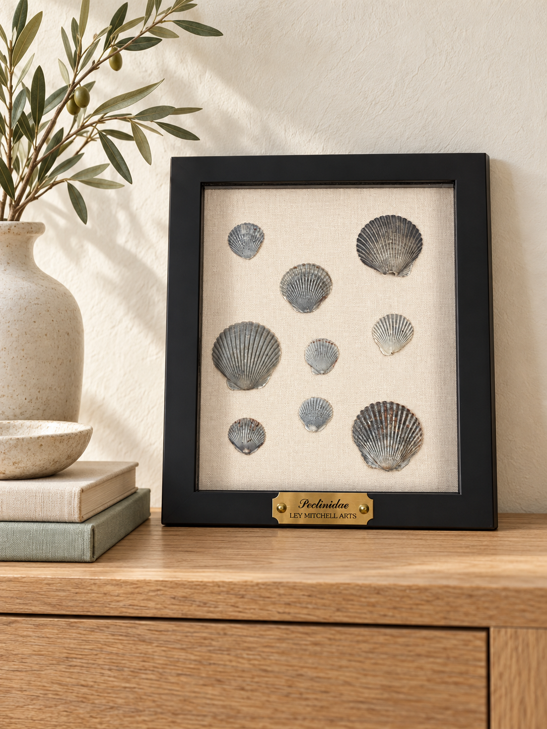 Styled room mockup of charcoal and gray scallop shell artwork on an oak console; see product photographs for actual artwork.